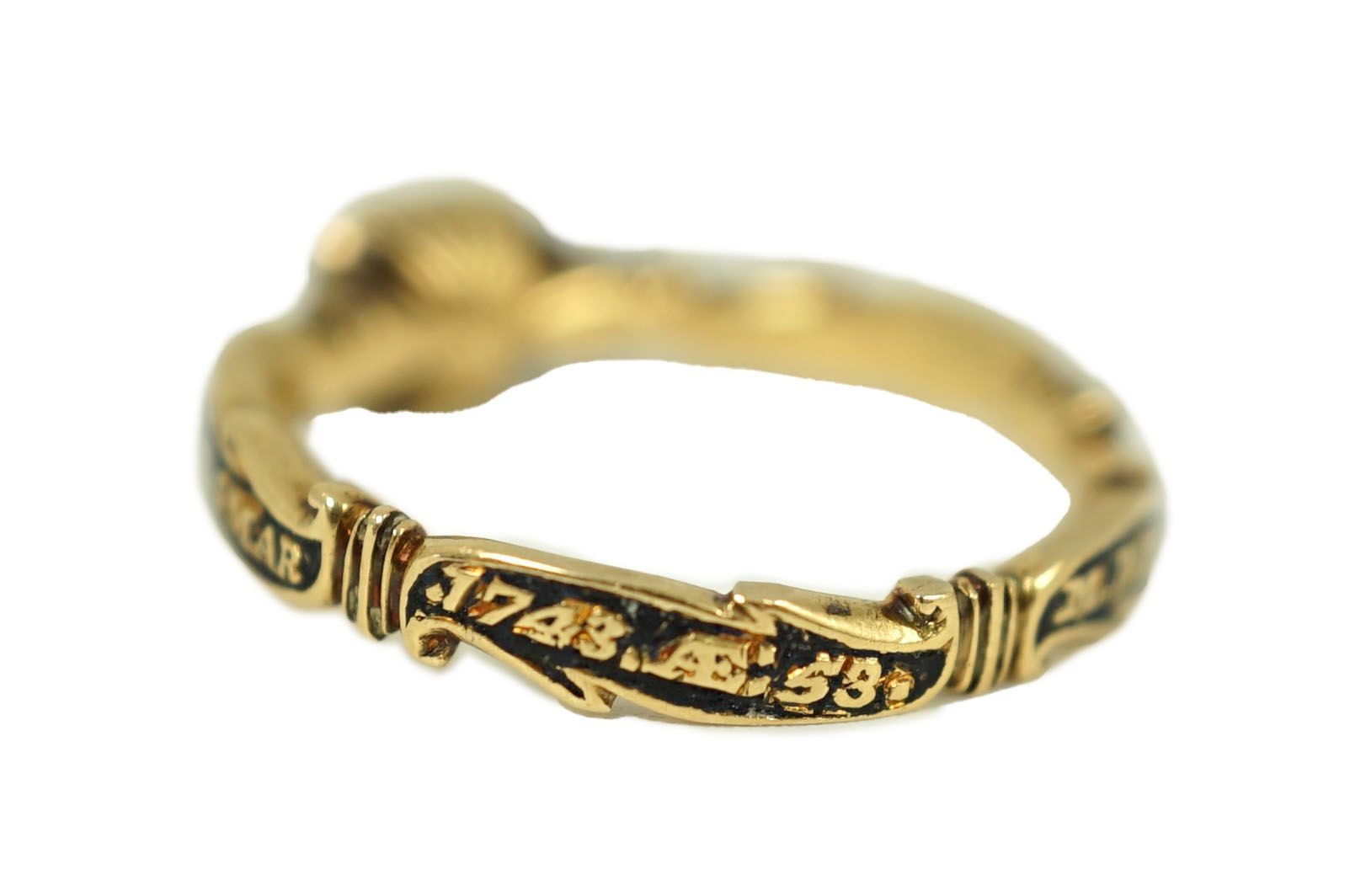 A George II gold, black enamel and rock crystal set mourning ring